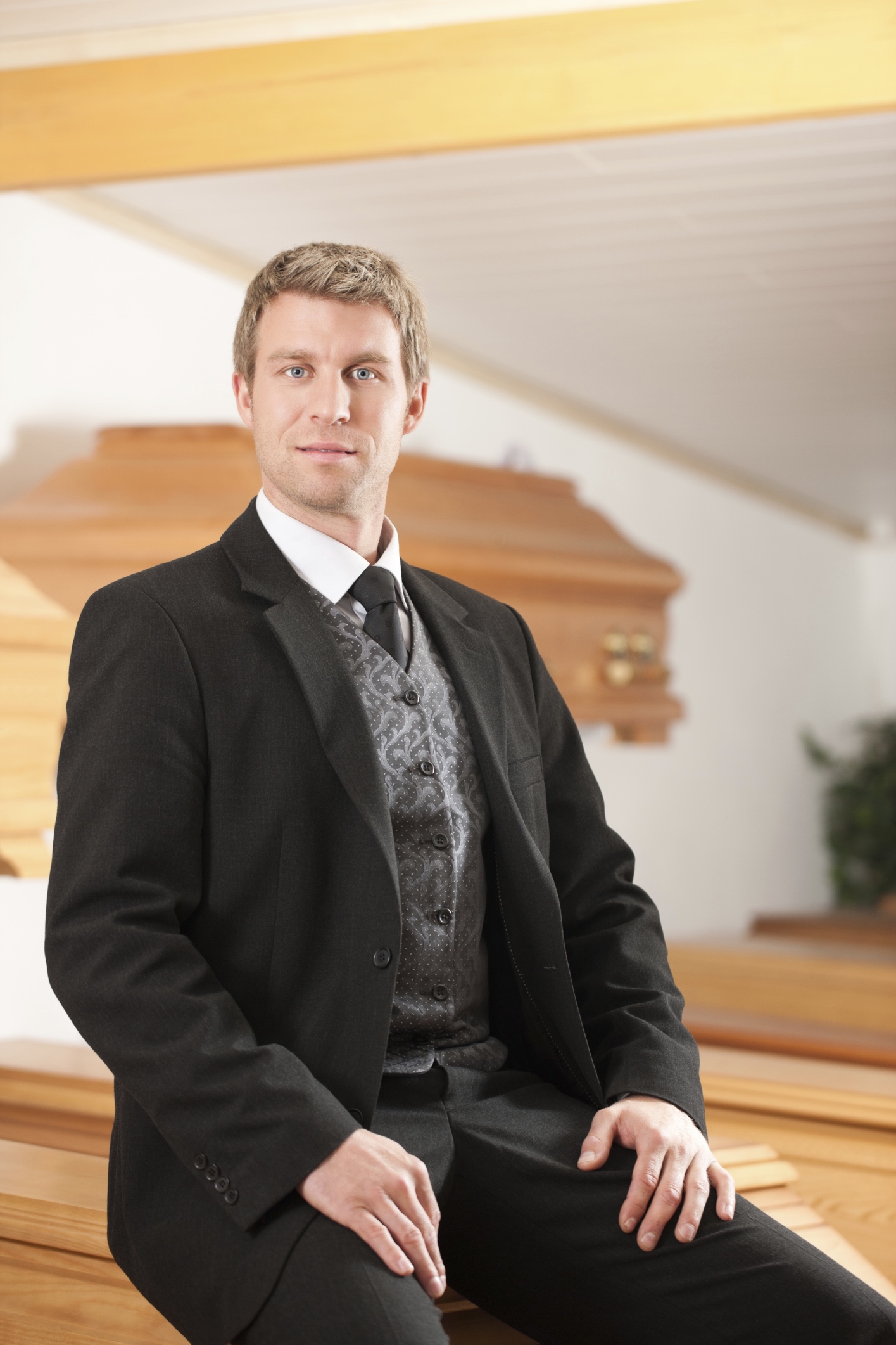 A funeral director at a funeral home. 