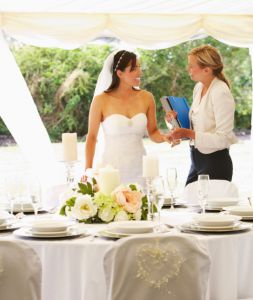 A wedding planner assisting the bride