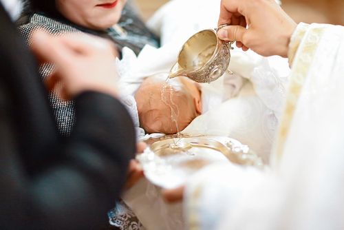 A Baby Being Baptized
