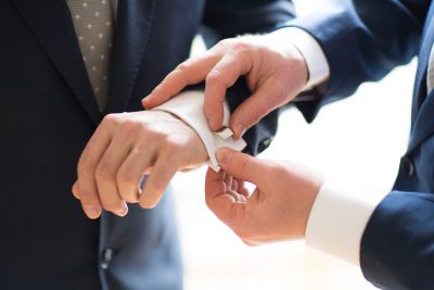 Best Man Assisting Groom