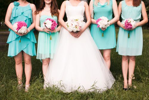 Bride With Bridesmaids Wearing Different Dresses
