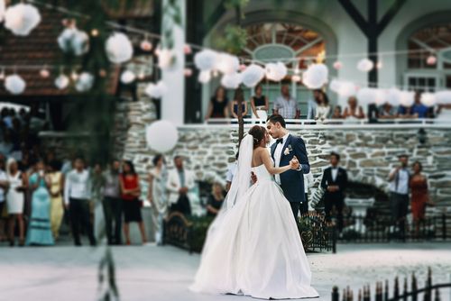 Bride and Groom Dancing Outdoors