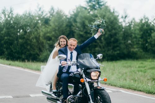 Bride and Groom Eloping on a Motorcycle