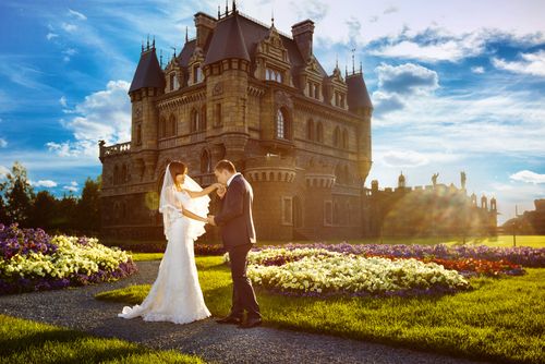 Bride and Groom in Front of a Castle