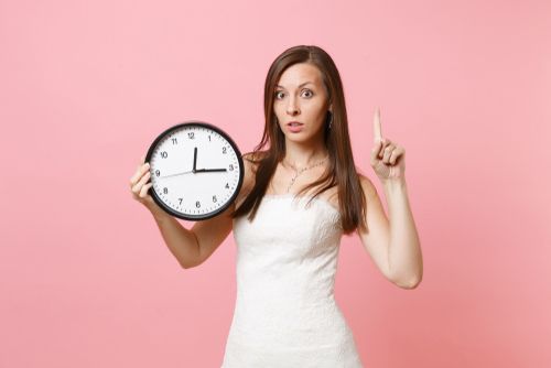 Bride Holding a Clock