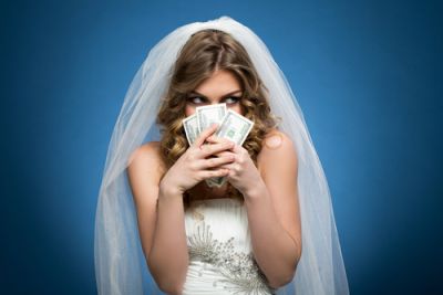 Bride in Wedding Dress Holding Cash