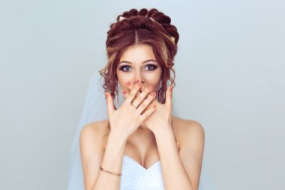 Bride With Hands Over Her Mouth