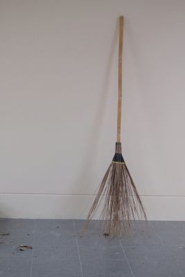 Broom Leaning Against a Wall