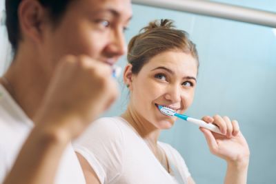 Couple Brushing Their Teeth