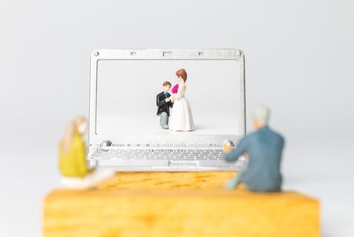 Couple Watching a Virtual Wedding