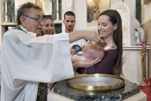 A Cute Baby Being Baptized