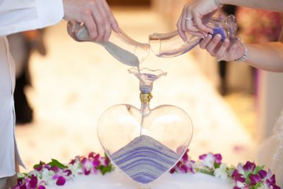 Couple Filling a Heart With Sand