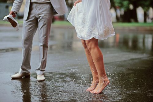 Groom and Bride Dancing in the Rain