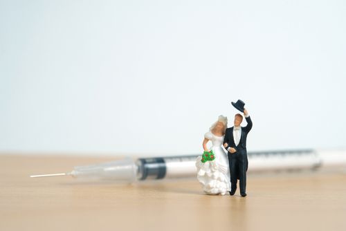 Groom and Bride in Front of a Syringe