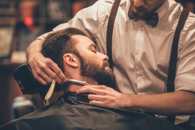 A Man Getting a Professional Shave