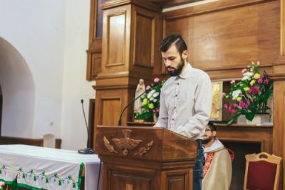 Man Reading at a Wedding