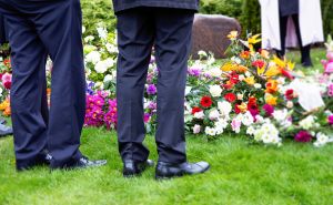 Men Paying Respects at Funeral