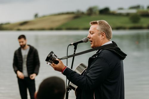 Minister Singing at a Baptism