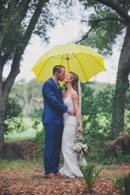 Bride and Groom Under an Umbrella