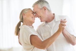 Romantic Older Couple Dancing At Home