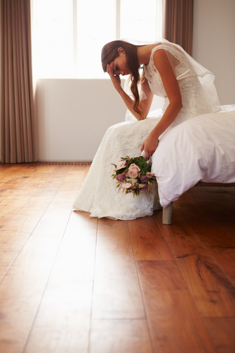 Bride looking distressed on her wedding day