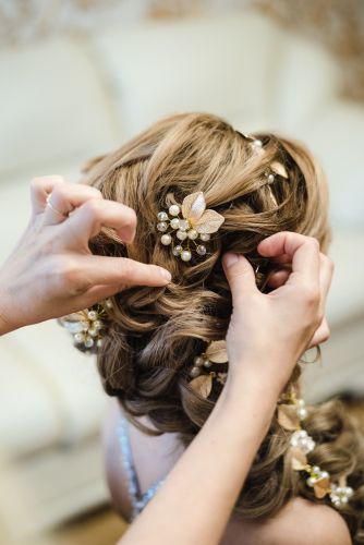 Stylist Arranging an Intricate Hairstyle