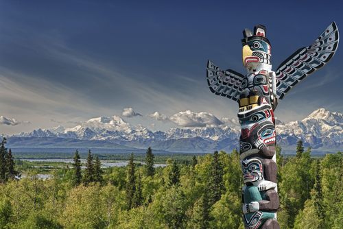 Totem Pole Overlooking a Field