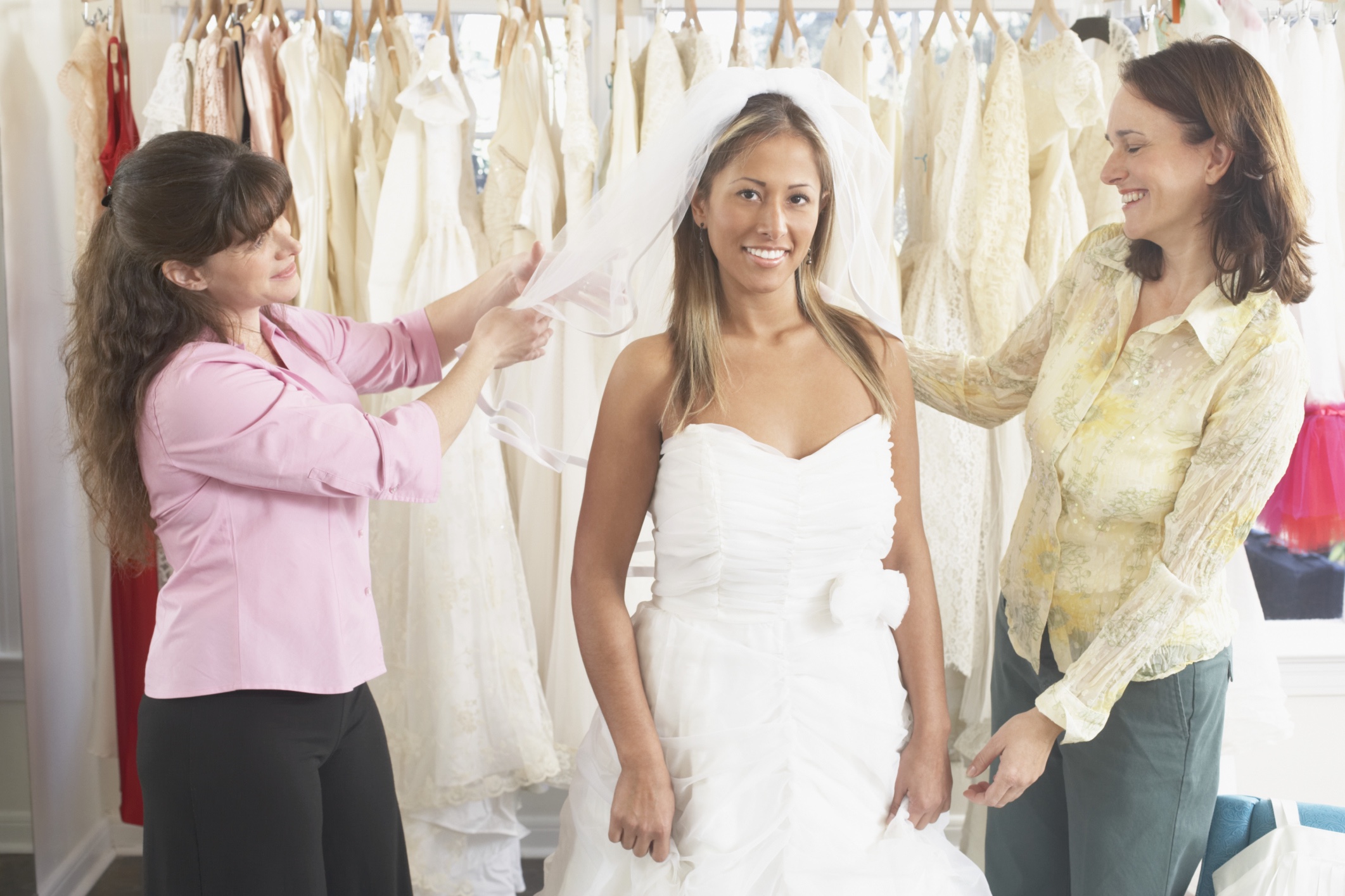 A bride trying on her wedding dress