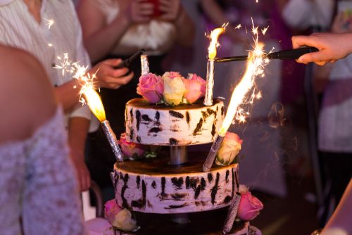 A wedding cake with sparklers