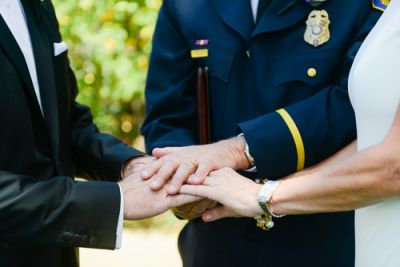 Wedding Officiant With Bride and Groom