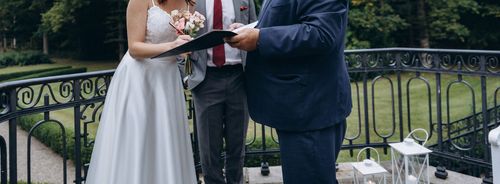 Wedding Officiant With Groom and Bride