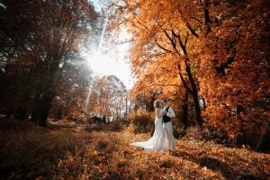 beautiful couple walking in the autumn lawn