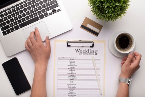 Wedding Planning Checklist Next to a Computer