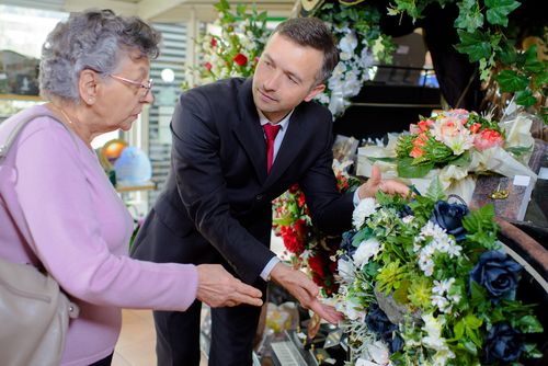 Woman Choosing Funeral Flowers