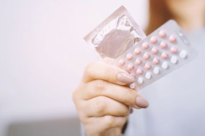 Woman Holding Birth Control