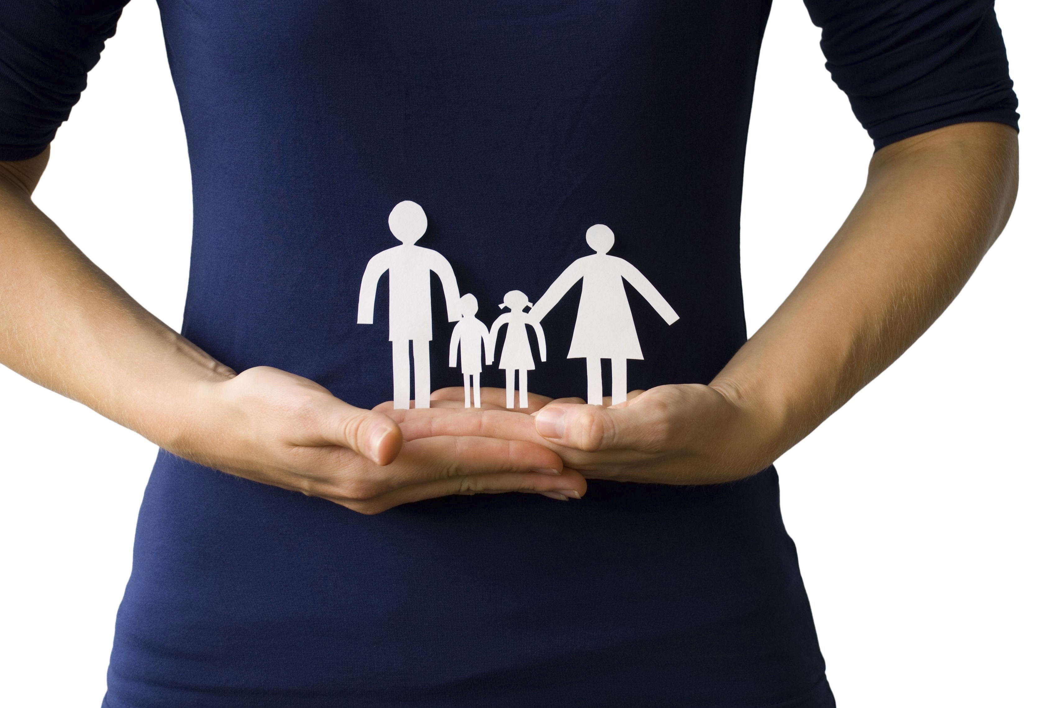 A woman with family cutouts in hand. 