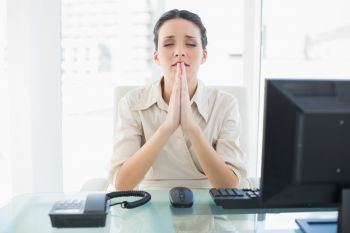 Woman Praying at Work