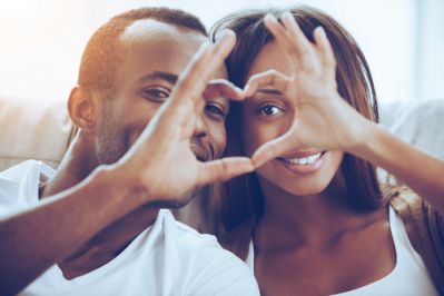 Young Couple Making Heart Hands