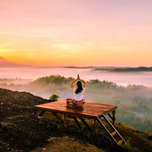 Woman Doing Yoga at Sunset