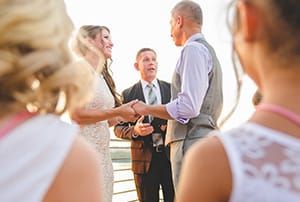 Ordained Minister Presides Over Vow Exchange At Wedding