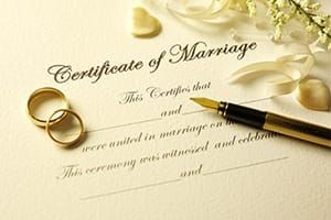 Married Couple Sign Legal Marriage Certificate