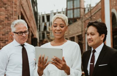 A group of ministers researching on a tablet