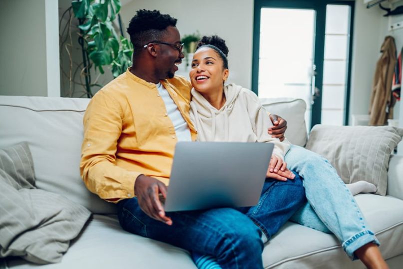 A couple researching the steps to marry someone