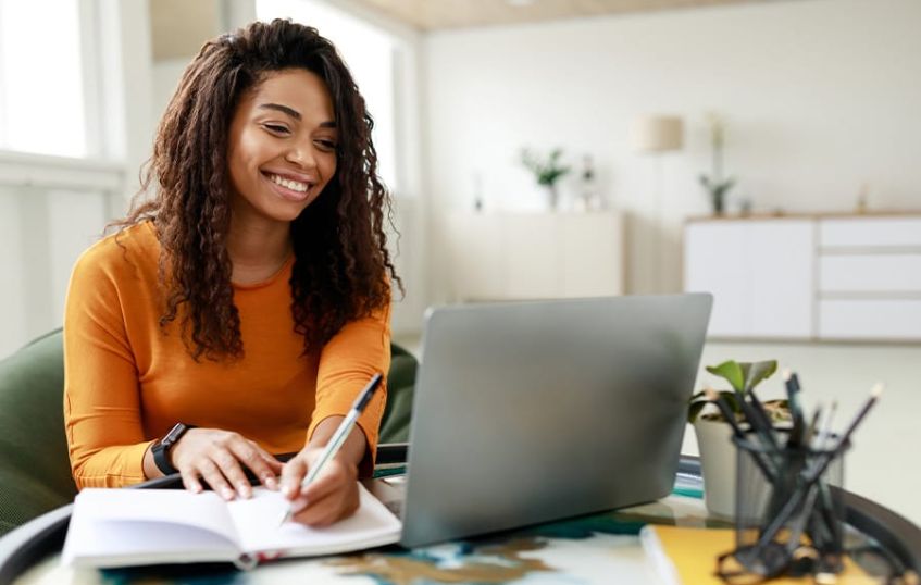 A woman researching on her laptop